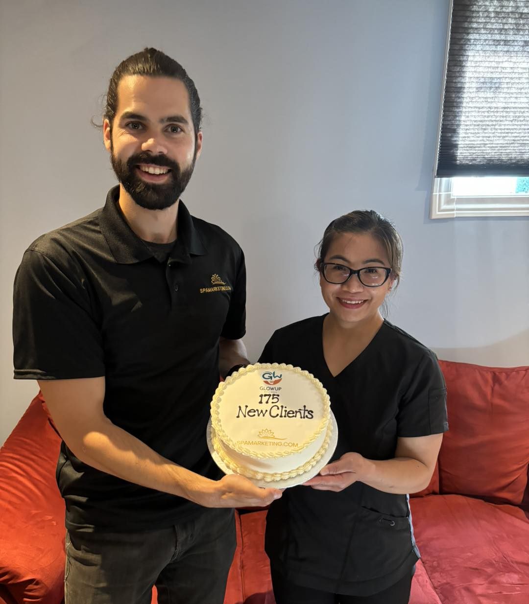 Spamarketing.com co-founder celebrating new clients with a massage clinic owner